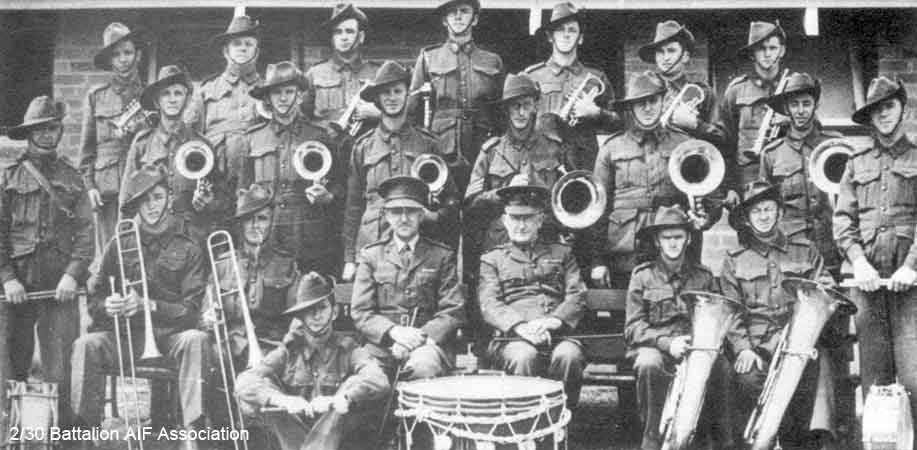 1st ITB Band
1st Infantry Training Battalion Band at Wagga Wagga on 5/2/1941, fifteen of whom later served with the 2/30th.

Left to right:

Back row:
1) NX68235 - COPLEY, Francis Peter (Frank), Pte. - BHQ, Band
2) ? - BLACK, E.
3) NX36270 - ELPHICK, James Jack (Jack), Pte. - BHQ, Band
4) NX36443 - RINGWOOD, Stanley (Stan), Sgt. - BHQ, Band
5) NX36324 - BROUFF, Charles William (Charlie), Pte. - BHQ, Band
6) NX68237 - HODGE, William Peter (Bill), Pte. - BHQ, Band
7) NX68236 - LUGTON, Stanley James (Stan), Cpl. - BHQ, Band

Middle row:
1) ? - FRENCH, M.
2) ? - SEABROOK-BIGGS, A.
3) NX36267 - WHITTERON, Edward Sprowell (Eddie), Pte. - BHQ, Band
4) ? - HOMANN, Sgt. (Band Master)
5) NX68232 - TEMPLEMAN, John James (Ben), Pte. - BHQ, Band
6) ? - PARSONS, A.

Front row:
1) NX68238 - DESMET, Stanley Job (Bill or Stan), Pte. - BHQ, Band
2) NX35482 - MOUNTFORD, Lawrence Gordon (Laurie), L/Cpl. - BHQ, Band
3) ? - JOHNSON, Capt.
4) ? - FORD, Colonel, (C.O.)
5) ? - CARTHEW, E.
6) NX36839 - EDMONDSTONE, Bertie Joseph (Bert), Pte. - BHQ, Band

Standing to left side:
1) NX36098 - HART, James (Shorty or Jim), Pte. - BHQ, Band

Standing to right side:
1) NX36719 - MONTGOMERY, James William (Monty or Jim), Pte. - BHQ, Band

Front seated:
1) NX36271 - GOUGH, William George (George), Pte. - BHQ, Band 
