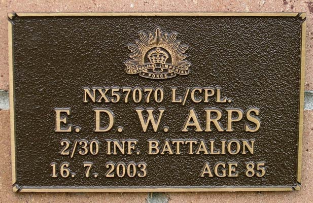NX57070 - ARPS, Eric Douglas Wade, L/Cpl. - A Company, 7 Platoon
View of the bronze plaque erected in the NSW Garden of Remembrance on Wall ?, Row ?. The garden is adjacent to Sydney War Cemetery at the Rookwood Necropolis, and is maintained by The Office of Australian War Graves.

The plaques are provided by The Office of Australian War Graves to commemorate eligible veterans who have died post war and whose deaths are accepted as being caused by war service. This form of commemoration is used when there is a private memorial elesewhere, or for some reason, the Office is unable to provide an official memorial at the relevant Cemetery or Crematorium.
Keywords: 100125a