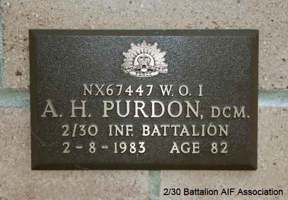 NX67447 - PURDON, Arthur Henry Mason, WO1 - BHQ, RSM
View of the bronze plaque erected in the NSW Garden of Remembrance on Wall 4, Row H. The garden is adjacent to Sydney War Cemetery at the Rookwood Necropolis, and is maintained by The Office of Australian War Graves.

The plaques are provided by The Office of Australian War Graves to commemorate eligible veterans who have died post war and whose deaths are accepted as being caused by war service. This form of commemoration is used when there is a private memorial elesewhere, or for some reason, the Office is unable to provide an official memorial at the relevant Cemetery or Crematorium.
