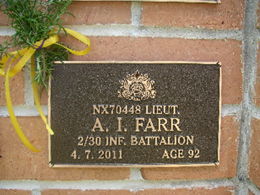 NX70448 - FARR, Albert Irwin (Bub), Lt. - HQ Company, O/C Signals Platoon
View of the bronze plaque erected in the NSW Garden of Remembrance on Wall ?, Row ?. The garden is adjacent to Sydney War Cemetery at the Rookwood Necropolis, and is maintained by The Office of Australian War Graves.

The plaques are provided by The Office of Australian War Graves to commemorate eligible veterans who have died post war and whose deaths are accepted as being caused by war service. This form of commemoration is used when there is a private memorial elesewhere, or for some reason, the Office is unable to provide an official memorial at the relevant Cemetery or Crematorium.
Keywords: 20120129b