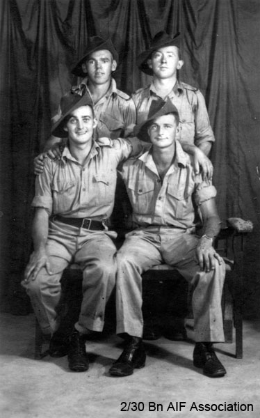 On leave in Singapore, 14/12/1941
Left to right:
Back row: 
1) NX47537 - NEWMAN, John Patrick (Jack), Pte. - D Company, 17 Platoon
2) NX37305 - KENTWELL, Ronald (Popeye), Pte. - C Company, 13 Platoon

Front row:
1) NX45449 - GEAR, Neville Lance, Pte. - D Company, 17 Platoon
2) ?? NX10661 - CAREY, Luke Robert, Pte. - HQ Mortar
Keywords: Singapore D_Company 17_Platoon C_Company 13_Platoon HQ_Mortar