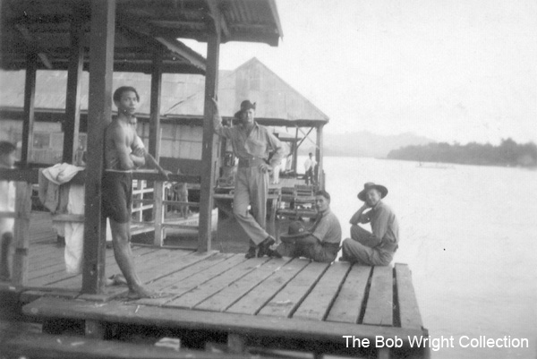 Riverside quay, Batu Pahat
"Hank", "Togo" and "Baldy". Riverside quay, October, 1941. Batu Pahat.

Left to right:
1) NX25715 - MASSEY, Thomas Fox (Hank), L/Cpl. - HQ Coy. Sig. Pl.
2) NX67449 - JOHNSON, Robert William (Togo), Cpl. - HQ Coy. Sig. Pl. Doi Sonkurai 1 (Acute Bacillary Endocarditis)
3) NX30495 - MOORE, Frank Montague (Baldy), Cpl. - HQ Coy. Sig. Pl. 

1. The photographs are to be known as The Bob Wright Collection.
2. Reproduction of the Collection or any part of it is prohibited without written permission.
3. Permission is granted to the 2/30th Batallion Association to reproduce the Collection as it deems appropriate.
4. Permission is granted to the Australian War Memorial Museum to reproduce the Collection as it deems appropriate.
5. All other permission is specifically withheld.
6. Written application for permission to reproduce the Collection, or part of it, may be made to:
Mr I. Wright
95 Hewitt Avenue
Wahroonga 2076 New South Wales

