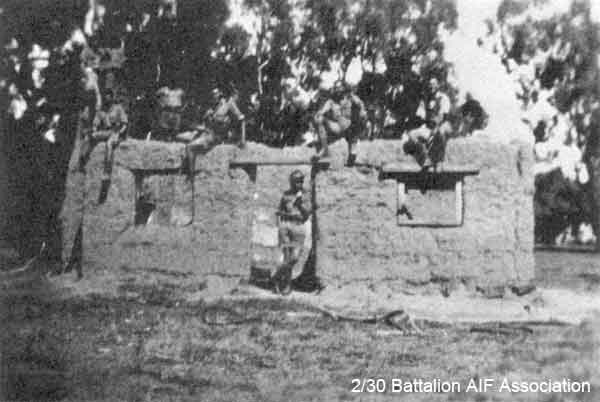 Training Area at Bathurst
The walls of a convict built mud hut in the rear of "B" Company training area at Bathurst.

Can anyone remeber who are in the picture?

Photo supplied by Jim CANN the brother of:
1) NX31694 - CANN, Basil Arthur (Dan), Pte. - B Company, 12 Platoon
