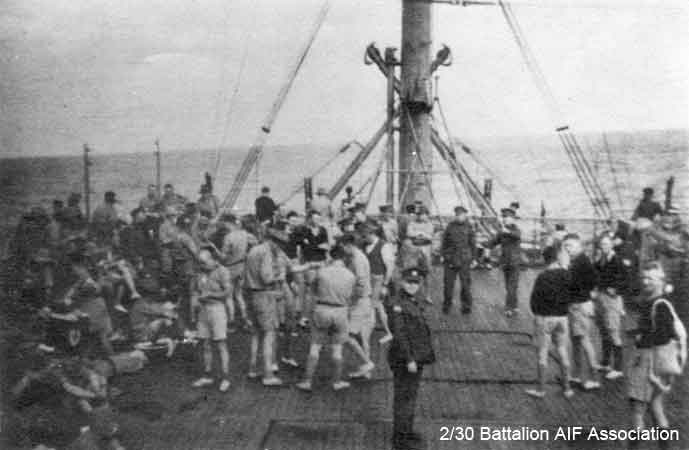 On the way to Singapore
On the deck of Johan Van Oldenbarnevelt (HMT FF).

In the right foreground is:
1) NX31010 - AMBROSE, Robert (Bob or Lofty), Sgt. - HQ Company, Carrier Platoon
