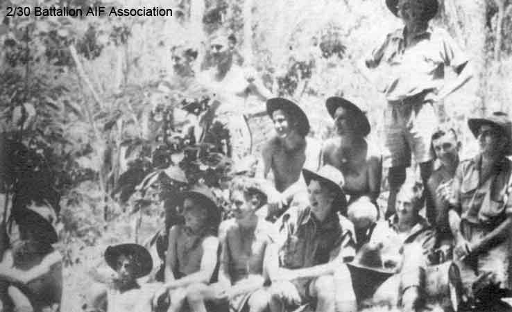 Training in Malaya, 1941
"B" Company, 10 Platoon at Batu Pahat on 28/10/1941.

Left to right:

Standing at rear:
1) NX59138 - SULLIVAN, Francis Michael (Sully or Frank), A/Cpl. - B Company, 10 Platoon
2) NX33364 - CHALMERS, James Leslie (Jim), Pte. - B Company, 10 Platoon
3) NX47140 - DALTON, Ronald B. (Dolly or Ron), Pte. - B Company, 10 Platoon

Middle row:
1) NX37485 - FERRY, Arnold Brendan (Arnie), L/Cpl. - B Company, 10 Platoon
2) NX37646 - KING, Roy Rutherford, Pte. - B Company
3) NX48749 - HALL (Gifford), John (Maxwell Vernon) (China), Pte. - C Company
4) NX37402 - NAY (Davy), James Charles (Darky), Pte. - B Company, 10 Platoon

Front row:
1) NX25845 - BUCKINGHAM, Arthur George, A/U/Cpl. - B Company, 10 Platoon
2) NX26367 - SMITH, Allan Claude, Pte. - B Company, 10 Platoon
3) VX25897 - FORBES, Kenneth William (Ken), Pte. - B Company, 10 Platoon
4) NX32244 - PURVIS, Frank, Cpl. - B Company, 10 Platoon
5) NX37359 - FARLEY, Chumley Jack Henry (Chum), Pte. - B Company, Coy. HQ
6) NX69322 - GRIFFITHS, Frederick Wallace (Professor or Fred), Pte. - B Company, 10 Platoon
