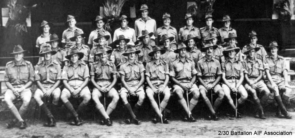 Officers and NCO's, A Company
"A " Company Officers and NCO's at Batu Pahat Camp, November 1941.

Left to right:

Back row:
1) NX30772 - SIMPSON, John Francis (Curly or Jack), A/Cpl. - A Coy. 9 Pl. WiA Gemas
2) NX27550 - WILSON, David Royce (Doc), A/Cpl. - A Coy. 9 Pl.
3) NX29821 - BURGESS, Clarence John (Clarrie), L/Cpl. - A Coy. 7 Pl.
4) NX26692 - BLOMFIELD, Alfred Lindsay (Curly), L/Cpl. - A Coy. 8 Pl. WIA Gemas
5) NX54837 - BLACKWOOD, Lindsey Burns (Dicey), L/Cpl. - A Coy. 8 Pl. KiA Gemas
6) NX34443 - EVANS, Garrett William (Garry), L/Cpl. - A Coy. 8 Pl.
7) NX51454 - ABRAHAMS, Harry Stirling (Harry), Cpl. - A Coy. 7 Pl.
8) NX57070 - ARPS, Eric Douglas Wade, L/Cpl. - A Coy. 7 Pl. WiA Gemas
9) NX31681 - PEARCE, Norman Ede (Norm), L/Cpl. - A Coy. 7 Pl. KiA Gemas

2nd row:
1) NX31018 - BRENNAN, Vincent Joseph (Vince), Pte. - A Coy. 9 Pl. WiA Gemas, Rep 10/2/1942
2) NX26921 - RYAN, Francis Ulric (Frank), Cpl. - A Coy. 9 Pl.
3) NX57453 - HAMILTON, John Allan Reginald (Allan), Cpl. - A Coy. 9A Pl. WiA Gemas
4) NX56869 - BLANSHARD, Douglas Copeland (Doug), Sgt. - A Coy. 8 Pl.
5) NX54846 - ARNEIL, Stanley Foch (Horse), Sgt. - A Coy. 7 and 8 Pl. A.M.
6) NX33384 - SKUSE, Edward Frederick (Ted), Cpl. - A Coy. 8 Pl.
7) NX29973 - HALL, Rex Turnbull Sinclair (Sammy), A/L/Sgt. - A Coy. 7 Pl.
8) NX34417 - ROSS, Ernest Stanley (Dan), Cpl. - A Coy. 7 Pl. WiA Gemas
9) NX27118 - COLLINS, Henry Edward (Harry), Cpl. - A Coy. 7 Pl.
10) NX56718 - BURBURY, Charles Maxwell (Max), L/Sgt. - A Coy. Ord. Room.

Front row:
1) NX32388 - RICKWOOD, Garrett George (Garry), A/S/Sgt. - D Coy. Pl.
2) NX34400 - ROBERTSON, Stuart Wilkinson, Sgt. - A Coy. 8 Pl. MiD
3) NX66652 - JOHNSTON, Bruce Hutton (Bull Frog), A/WO2 - A Coy. 7; CSM Pl. Doi Kanu 2 (Cholera)
4) NX70440 - BOOTH, Lyndon Harold (Lyn), Lt. - A Coy. O/C 7 Pl. Pl. WiA Gemas
5) NX70441 - GREER, Bruce John Kirkwood, Lt. - HQ Coy. O/C Pioneer Pl.
6) NX70435 - ANDERSON, Roderic Henry, Maj. - A Coy. O/C A Coy. Pl. MiD ED.
7) NX70486 - BOOTH, Edward Holroyd (Baldy), Capt. - D Company, O/C
8) NX70437 - KEARNEY, Peter Desmond (Black Prince), Capt. - B Coy. 2 l/c B Coy.
9) NX68127 - SMYTH, Frank Miles (Wakey Wakey), Lt. - A Coy. CSM. KiA Johore Straits
10) NX67414 - ROWE, Rex William, A/U/WO2 - A Coy. CSM. MiD
11) NX26103 - GADEN, John Burton, S/Sgt. - A Coy. CQMS.
