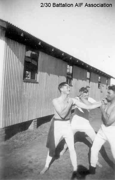Training in Bathurst
Boxing practice at Bathurst Army Camp, 1941

Left to right:

1) [url=http://www.230battalion.org.au/NominalRoll/Search/index.php?table_name=230nominalroll&function=details&where_field=fldArmyNumber&where_value=NX4417] NX4417 - PEARCE (Pearson), Bruce Donald (Donald Bruce) (Joe), Pte. - A Company, 8 Platoon [/url] 
2)  [url=http://www.230battalion.org.au/NominalRoll/Search/index.php?table_name=230nominalroll&function=details&where_field=fldArmyNumber&where_value=NX27550] NX27550 - WILSON, David Royce (Doc), A/Cpl. - A Company, 9 Platoon[/url] 
3) NX25485 - GAGE, Frederick Clifton (Fred), Pte. - Discharged 7/7/1941
