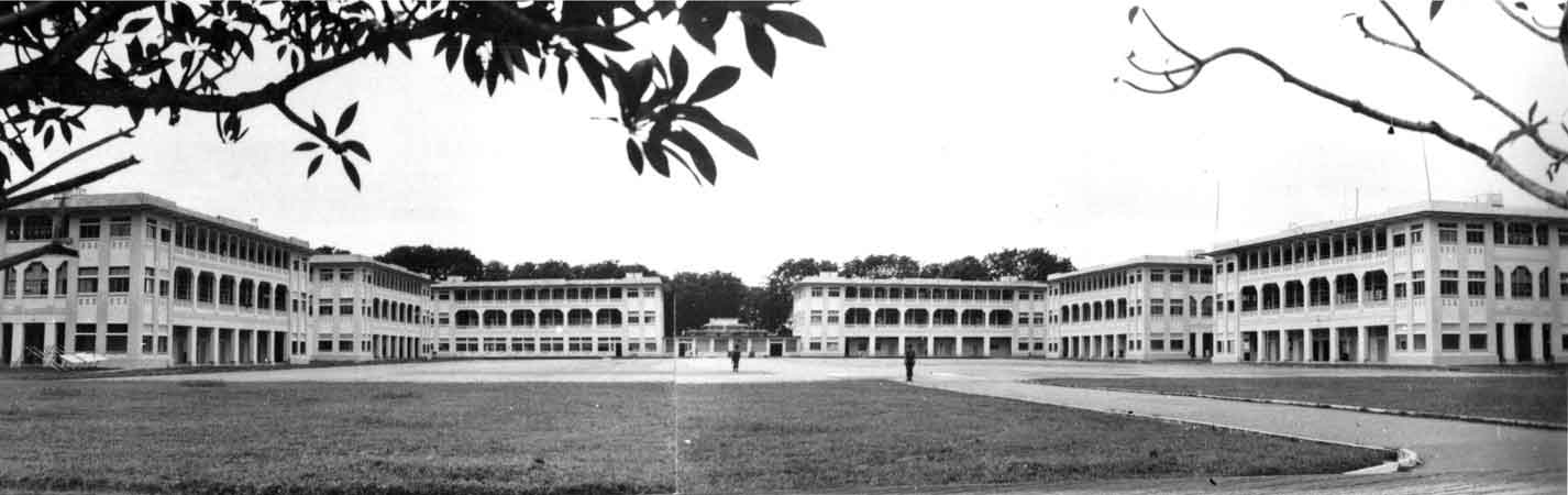 Selarang Barracks
During the period that the 8th Division were held as Prisoners of War in Selarang Barracks, the buildings shown in this photo housed (from left to right):

1)
2) 8th Division, 22nd Brigade
3) Q Store Mess
4) Cookhouse (Gordons) (small building in centre of photo)
5)
6) 8th Division, 27th Brigade (including 2/30 Battalion)
7)

The road to the water tower headed off to the right, from where the photo was taken.

(Information provided by Bill DESMET in December, 2006)
