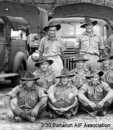 Transport Platoon - part 1
Transport Platoon in Malaya (probably at Batu Pahat)
 
Left to right:

Back row (standing):
1) NX47823 - TAYLOR, George Gorman, Pte. - HQ Company, Transport Platoon
2) NX65871 - ALLARDICE, Stephen Russell (Steve), Sgt. - HQ Company, Transport Platoon HQ

Middle row (kneeling):
1) NX46451 - AINSWORTH, Arnold Marsh (Arnie), Pte. - HQ Company, Transport Platoon
2) NX47777 - LATTIMER, James William Clarence (Clarrie), A/Cpl. - HQ Company, Transport Platoon
3) NX37745 - ASPINALL, George Henry (Changi), Pte. - HQ Company, Transport Platoon

Front row (sitting cross legged):
1) NX34039 - WRIGHT, Thomas Clyde, Pte. - HQ Company, Transport Platoon
2) NX47632 - ODGERS, Jack Carlyle (Carl), Pte. - HQ Company, Transport Platoon 
3) NX2569 - MONTFORD, Ronald Milton (Ron), Pte. - HQ Company, Transport Platoon
Keywords: Makan332 070121