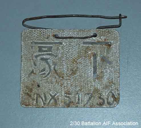 POW Identity Tag 2 - NX51730 - L/Sgt. A. W. J. ISAAC
The identity tag which was worn by Arthur ISAAC whilst he was a POW. The tag was made from scrap aluminium, and still has traces of mud on it from the time that Arthur worked on X1 Tunneling Party. Inscribed on the tag is his Army Number, NX51730.

NX51730 - ISAAC, Arthur William John (Ike), A/U/L/Sgt. - D Company, 17 Platoon
Keywords: 070218b