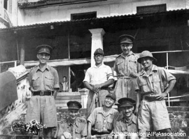 X1 Tunneling Party, Johore
Officers and Japanese guards attached to X1 Tunneling Party in Johore in 1945.

Left to right (standing):

1)
2)
3)
4)

Seated:
1) 
2)
3) NX34792 - DUFFY, Desmond Jack (Mum or Des), Capt. - O/C B Company

Keywords: 070506