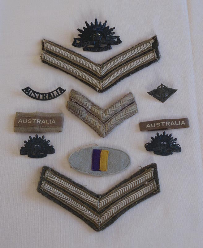 Various Insignia
Includes 2/30 Battalion colour patch, Rising Sun badges, shoulder badges, and Corporal stripes.
Keywords: 100214c NX32306