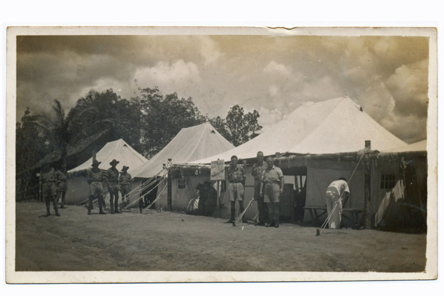 Army camp, Malaya
Army camp, Malaya.  Annotated on reverse:
"This used to be where we worked"

Sign in middle of photo reads: "General Base Depot A.I.F. Administrative H.Q."
Keywords: 20120722 NX30114