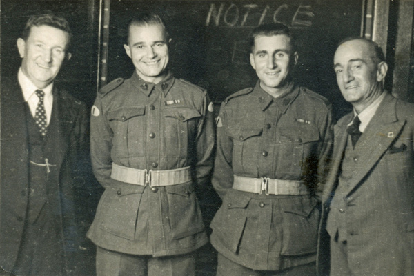Bill’s enlistment party
Bill’s enlistment party.  Annotated on reverse:

"Mr Jones Bill E Pascoe and his father you remeber Mr Jones who use to Preach he was Chairman at Bill's Party Love Mum"

Re-Order Leica Photos Arcade Parramatta

Left to right:
1) Mr. Jones
2) NX30114 - Pte. William Hartridge (Bill) SKENE - C Company, 14 Platoon
3) NX50018 - Pte. Eldred Leslie PASCOE - 2/29 Battalion (ex 2/30 Bn. Reinforcements)
4) Mr. Pascoe

Keywords: 20120722 NX30114