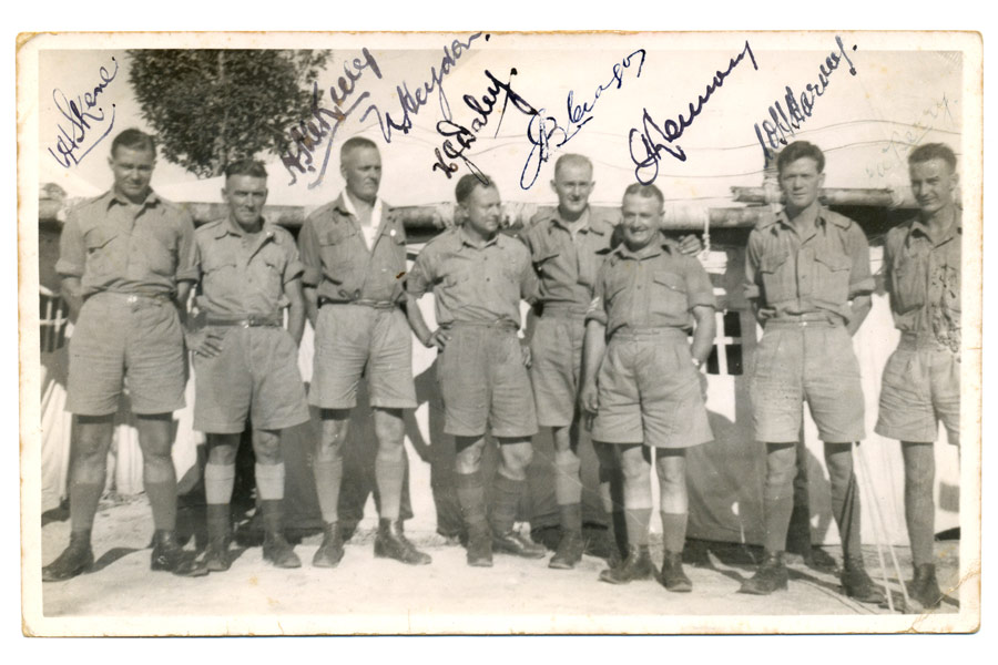 In camp in Malaya
In camp in Malaya.  Annotated on reverse: The Lads who make the wheels go round.  Signed by from left to right: W H Skene, H McKeeley, W Heydon, H J Daley, J B C(illegible), J (illegible), W H Harvey and E Berry.

Left to right:
1) NX30114 - Pte. William Hartridge (Bill) SKENE - C Company, 14 Platoon
2) H McKeeley
3) W Heydon (possibly NX30032 - Pte. Norman Charles HEYDON - 2/18 Battalion)
4) H J Daley (possibly NX50577 - Sgt. Harley James DALEY - 2/20 Bn.)
5) J B C(illegible)
6) J (illegible)
7) W H Harvey (possibly NX14058 - Pte. William Henry HARVEY - 2/18 Battalion)
8) E Berry
Keywords: 20120722 NX30114