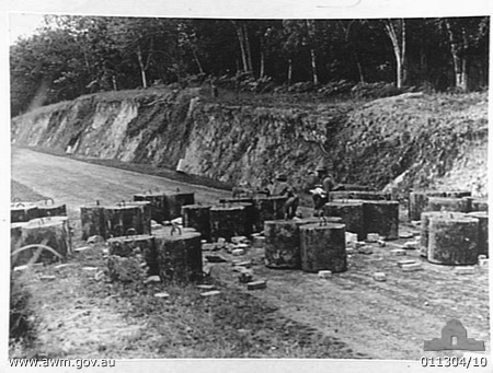 Tank Trap, Gemas
1942-01, MALAYA. WHEN THIS PHOTOGRAPH OF AN AIF CONSTRUCTED ROAD BLOCK WAS TAKEN, THE ENEMY WAS LESS THAN A QUARTER OF A MILE AWAY.

Sitting on the concrete blocks are:

1) NX46739 - HYSLOP, Andrew   (Andy), Lt. - BHQ, Intell.
2) NX29925 - BELL, Walter Lind (Wally Mark 1), L/Cpl. - A  Company, 8 Platoon or NX30430 - BELL, Wallace Speare (Wally Mark 11), Pte. - A Company, 8 Platoon

Source: Makan 193, Jan/Feb, 1971



Keywords: 100105c