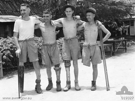 Men wearing artificial limbs
Australian War Memorial caption reads:
Changi Prison Camp, Singapore. 1945. All these men are wearing artificial limbs made in the camp by Warrant Officer Arthur Purden of East Maitland, NSW. The men are in good spirits and are glad that they will soon be on their way home. Left to right: NX33254 Private Max Bradford of Sydney, NSW, a member of the 2/20th Battalion; VX36959 Lance Corporal Jack Campbell of Apollo Bay, Vic; WX16376 Private Steve Gleeson of Mundijong, WA, a member of the 2/2nd Machine Gun Battalion; NX41338 Alex McKenzie, of Boggabri, NSW, a member of the 2/30th Battalion.

[b]2/30 Battalion Association notes:[/b]
NX67447 - PURDON, Arthur Henry Mason, WO1 - BHQ Coy. RSM. D.C.M.

Left to right:
1) NX33254 - BRADFORD, Maxwell Alexander, Pte. - 2/20 Battalion
2) VX36959 - CAMPBELL, John (Jack), L/Cpl. - 2/10 Field Company
3) WX16376 - GLEESON, Stephen John, Pte. - 2/4 Machine Gun Battalion
4) NX41338 - McKENZIE, Alexander (Alex), Pte. - 2/30 Battalion, A Company, 7 Platoon (wounded in action at the Causeway, 9/2/1942. Shrapnel wound, right leg amputated; shrapnel wound, right hand with finger loss of terminal phalanx; shrapnel wound to the head, fractured skull)
Keywords: 100105c