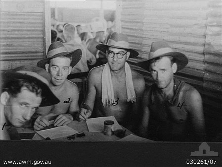 POW at Manila, 4/9/1945
Australian War Memorial caption reads:
Manila, Philippine Islands. 4 September 1945. A group of Australian prisoners of war recovered from Japan ready for interrogation at No. 3 Australian Prisoner of War Reception Group. Pictured, left to right: Private (Pte) D. G. Kentwell, 2/30th Australian Infantry Battalion; Pte G. E. Elbourne, 22nd Australian Brigade Workshops; Sergeant R. G. Moles, Australian Army Pay Corps (AAPC), and Pte R. F. Wells, 2/30th Australian Infantry Battalion.

NB: The AWM caption names one of the men as Sgt. R.G. Moles, but it is most probably VX27180 - Sgt. Archibald George MOLES, and NX47685 - WELLS is on the left and NX26144 - KENTWELL is on the right.

Left to right:
1) NX47685 - WELLS, Robert Frederick (Hook), Pte. - D Company, 18 Platoon
2) VX38317 - ELBOURNE, George Ernest, Pte. - 22nd Australian Brigade Workshops
3) VX27180 - MOLES, Archibald George, Sgt. - Australian Army Pay Corps (AAPC)
4) NX26144 - KENTWELL, Donald Geoffrey, Pte. - D Company, 18 Platoon
Keywords: 100105c Manila