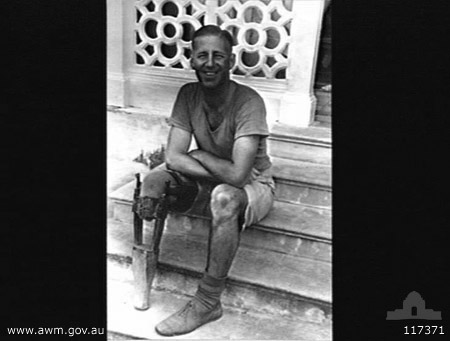 NX37544 - QUINTON, Reginald George, Pte. - BHQ Coy. D&P Pl.
Australian War Memorial caption reads:
BANGKOK, THAILAND. 1945-09-16. PRIVATE R. C. QUINTON, 2/30TH INFANTRY BATTALION, SEATED ON THE MAIN STEPS OF THE BANGKOK RED CROSS HOSPITAL DISPLAYING THE ARTIFICIAL LEG MADE FOR HIM WHILE A PRISONER OF WAR (POW) OF THE JAPANESE BY SERGEANT R. WILSTONCROFT, 2/12TH AUSTRALIAN FIELD COMPANY AT THE PATON POW HOSPITAL, NAKON.

Right leg amputated below knee, 7/7/1944; recovered from Japanese in Thailand on 20/8/1945; emplaned Singapore on 6/10/1945 for return to Australia; arrived Melbourne 8/10/1945; then by train to Sydney, arrived 9/10/1945
Keywords: 100105c