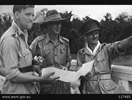 Gemencheh Bridge ambush site
Australian War Memorial caption reads:
GEMENCHEH, NEGRI SEMBILAN, MALAYA. 1945-09-25. LIEUTENANT R. W. EATON, 2/30TH INFANTRY BATTALION (LEFT), AND LIEUTENANT C. H. MOORE, 2/26TH INFANTRY BATTALION (RIGHT), BOTH 8TH DIVISION EX-PRISONERS OF WAR OF THE JAPANESE, WITH MAJOR E. D. O'ROURKE, 10TH MILITARY HISTORY TEAM, AUSTRALIAN MILITARY HISTORY SECTION (CENTRE), ON THE GEMENCHEH RIVER BRIDGE, WHERE ON 14 JANUARY 1942 TROOPS OF THE 2/30TH INFANTRY BATTALION, WITH NO. 30 BATTERY, 2/15TH FIELD REGIMENT, AND THE 4TH ANTI-TANK REGIMENT KILLED SOME 600 JAPANESE SOLDIERS DURING AN ENGAGEMENT.

Left to right:
1) NX70758 - EATON, Ronald Warr, Lt. - BHQ. Intelligence Officer, Adjutant. MBE 1947, OBE 1981
2) VX15174 - O'ROURKE, Edmond David, Major - 10th Military History Team and 6th Div AASC
3) QX6466 - MOORE, Clive Henry, Lt. - 2/26 Bn.
Keywords: 100105c