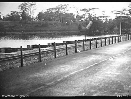 Causeway
AWM caption reads:

[b]Photographer:[/b]
Reddaway, Bruce A

[b]Description:[/b]
A section of the causeway linking the island forming part of the Straits Settlement to the State of Johore on the mainland of Singapore, which was held on the right flank by 'A' Company, 2/30th Infantry Battalion, 8th Division, on the 31 January 1942. Second part of a series of four photographs, other parts are 117541, 117543 and 117544.
Keywords: 100105c