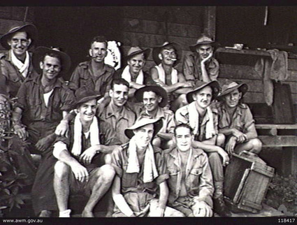 Kuching, Sarawak, 12/9/1945
Australian War Memorial caption reads:
KUCHING, SARAWAK. 1945-09-12. 8TH DIVISION PERSONNEL, EX-POWS OF THE JAPANESE, OUTSIDE THEIR HUT, "AUSTRALIA HOUSE" IN THE KUCHING POW AND INTERNMENT CAMP WHICH THEY OCCUPIED FROM 1943-06 UNTIL 1945-09. IDENTIFIED PERSONNEL ARE:- SERGEANT C. B. LANDER, 2/18TH INFANTRY BATTALION (1); CORPORAL G. W. GUNNING, 2/2ND PIONEER BATTALION (2); PRIVATE (PTE) H. J. P. RISELEY, 2/29TH INFANTRY BATTALION (3); PTE R. KENT, 2/20TH INFANTRY BATTALION (4); PTE E. DAVIS, 2/20TH INFANTRY BATTALION (5); DRIVER (DR) R. FRASER, 2/3RD MOTOR TRANSPORT COMPANY (6); DR STEPHENSON, 2/3RD MOTOR TRANSPORT RESERVE COMPANY (7); PTE D. RIXON, 2/20TH INFANTRY BATTALION (8); LANCE CORPORAL N. WEEKS, BASE ORDNANCE DEPOT (9); PTE J. SIMPSON, 2/18TH INFANTRY BATTALION (10); PTE F. BINDON, 2/18TH INFANTRY BATTALION (11); PTE S. OUTRAM, 2/30TH INFANTRY BATTALION (12).

1) NX15952 - LANDER, Colin Bruce, Sergeant - 2/18 Battalion
2) VX45832 - GUNNING, Gilbert William, Corporal - 2/2 Pioneer Battalion
3) TX8132  - RISELEY,  Hilton Phillip, Private - 2/29 Battalion
4) NX33432 - KENT, Roy Edward, Private - 2/20 Battalion
5) NX43494 - DAVIS, Eric George, Private - 2/20 Battalion
6) QX16801 - FRASER, Reginald John Alexander, Driver - 2/3 Motor Reserve Transport Company
7) NX69641 - STEPHENSON, Bruce Walter, Driver -2/3 Motor Reserve Transport Company
8) NX33861 - RIXON, Dick, Private - 2/18 Battalion
9) VX57346 - WEEKS, Norman, Lance Corporal - Base Ordnance Depot 
10) NX65330- SIMPSON, John Keith, Private - 2/18 Battalion
11) NX25645 - BINDON, Frederick, Private - 2/18 Battalion
12) NX37369 - OUTRAM, Sidney Murray, Private - 2/30 Bn., A Company, 8 Platoon. WiA Fort Rose, prisoner in Outram Rd. Gaol
Keywords: 100105c