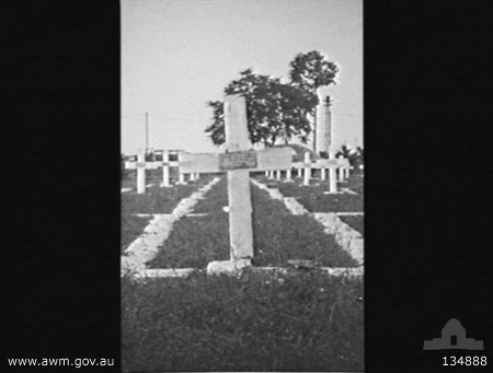 Grave of NX69869 - BIDDLE, Eric William, Pte.
AWM caption reads:
TAN SON NHUT, NEAR SAIGON, VIETNAM, 1954-03-06. GRAVE OF NX69869, PTE E.W. BIDDLE, 2/30TH AUSTRALIAN INFANTRY BATTALION, IN THE BRITISH WAR CEMETERY. PTE BIDDLE DIED ON 1944-09-22 WHILST A POW. HIS REMAINS HAVE SINCE BEEN EXHUMED AND INTERRED IN PLOT 26, ROW C, GRAVE 2, KRANJI WAR CEMETERY, SINGAPORE.

NX69869 - BIDDLE, Eric William, Pte. - B Company.  
Ex "A" Force; sent from Thailand to Singapore after Railway completed. Was to be sent to Japan but died of illness (Dysentry) 1120hrs 22/9/1944. Originally buried at Chihoa Cemetery, Saigon, Grave No. 24. Reburied at the British War Cemetery, Saigon on 1/4/1946, Grave 1.B.2. Reburied at Kranji War Cemetery in 1954, Grave 26.C.2 (Source: NAA Grave Registration sheet)
Keywords: 100105c