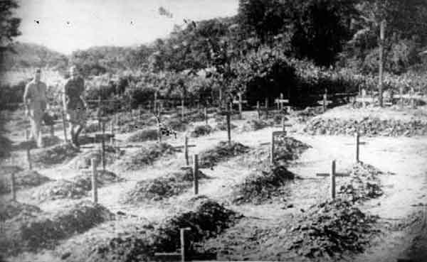 POW Graves, Thailand
"Graves at Tamarkan POW Cemetery, 1945"

There is a simliar photo on the AWM website (ID Number: 122314) with the following caption:

Khai Sai Yok, Thailand. 20 October 1945. Dutch and Australian officers moving through the Australian and British section of the cemetery, inspecting the conditions of the graves. Each grave is a mound of dirt marked by a small wooden cross.
