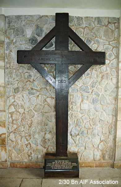 Thanbyuzayat War Cemetery, Burma (Mynamar)
This wooden cross is located within the entrance to the Cemetery. 

"In honour of Australian - Dutch - British - American 3 & 5 Branch Prisoners of War who died in Burma during construction of Burma Thai Railway"

The words at the bottom of the cross read:

This cross was made and set up in this cemetery where the Cross of Sacrifice now stands by men held prisoner during the years 1942-1945 and is preserved here as witness to their faith and fortitude
Keywords: Thanbyuzayat