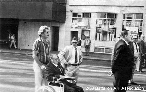 Anzac Day, Sydney, 1981
Anzac Day March, Sydney - 25/4/1981.

Centre row (L to R):
1) NX34500 - HILL, James Oswald (Jimmy), Pte. - HQ Company, Pioneer Platoon (in wheelchair) with his youngest son-in-law
2) NX44543 - JACKSON, William Ronald (Jacko or Ron), Pte. - B Company

Front row (L to R):
1) NX76207 - PEACH, Francis Stuart Banner (Stuart), Col. - BHQ, Adjt.
2) NX10243 - MASON, John Allan (Allan John) (Snowy), Pte. - D Company, 18 Platoon
Keywords: Makan261 AnzacDay1981