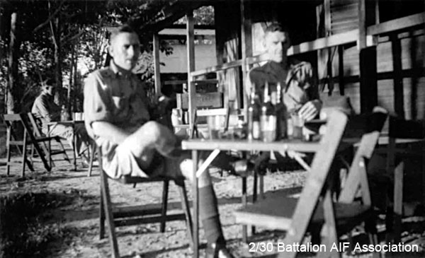 Relaxing at Changi
Sunday afternoon at Changi (probably Birdwood Camp)

Left to right:
1) NX70454 - BAYNES, Vernon, Lt. - D Coy.
2) NX31783 - LANSDOWNE, Harold Aubrey (Aub), A/S/Sgt. - E Coy. CQMS. Ex "A" Force; sent from Thailand to Japan after Railway completed; Awa Maru
