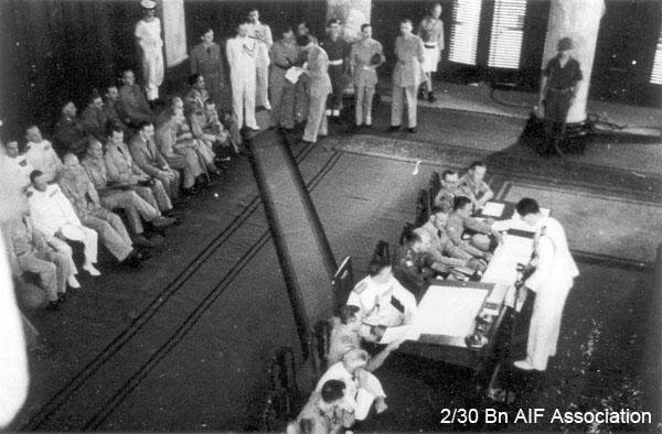 Japanese surrender, Singapore, 1945 (Photo 18)
018 - Lord Louis signs - Japanese surrender ceremony inside the Municipal Buildings in Singapore.
Keywords: Surrender