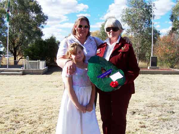 Anzac Day, Bathurst, 2006
The descendants of NX35786 - Pte. E.F. CAMPBELL, Jacqueline Small (daughter), Penelope Yow (grand daughter) and Jeminah Yow (great grand daughter) before the service at the Cairn, outside the gates of the former Bathurst Army Camp, on Anzac Day, 2006.
Keywords: 070112 AnzacDay2006