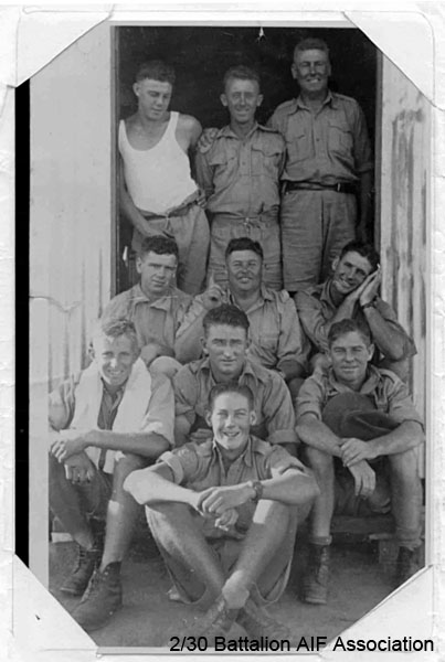 A Company, 8 Platoon
On the steps of their barracks at Bathurst.

Left to right:
Front row:
1) NX56869 - BLANSHARD, Douglas Copeland (Doug), Sgt. - A Coy. 8 Pl.

2nd Row:
1) NX29925 - BELL, Walter Lind (Wally Mark 1), L/Cpl. - A Company, 8 Platoon
2) NX47904 - NEWLANDS, Frederick George, Pte. - A Coy. 8 Pl.
3) NX33038 - REINHARD, Leslie John (Stinny), Pte. - A Coy. 8 Pl. Doi Sonkurai 3 (Chronic Dysentery, Beri Beri, Ulcers)

3rd Row:
1) NX34442 - CLYNE, Patrick James (Paddy), Pte. - A Coy. 8 Pl. WiA Causeway, Doi Sandakan
2) NX34443 - EVANS, Garrett William (Garry), L/Cpl. - A Coy. 8 Pl. 
3) NX29924 - GIBBS, Robert Fraser, Cpl. - A Coy. 8 Pl. 

Back Row:
1) NX26692 - BLOMFIELD, Alfred Lindsay (Curly), L/Cpl. - A Coy. 8 Pl. WIA Gemas
2) NX54500 - WILLIAMSON, Thomas (Tommy), Pte. - A Coy. 8 Pl. 
3) NX59213 - FEATHERSTONE, Frank Robert Henry - discharged 17/6/1941
