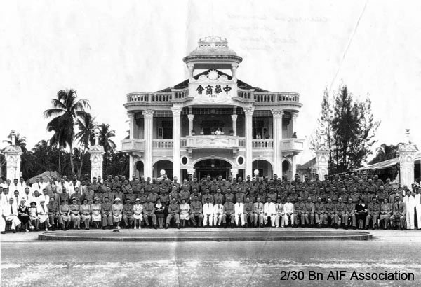 Batu Pahat Chinese Chamber of Commerce, Small Image (87kb)
Officers, NCO's & men of the 2/30 Battalion, and local citizens pose outside the Chinese Chamber of Commerce building in Batu Pahat, Malaya, 1941.

The Japanese later executed many of the Chinese businessman in the photo. This was because they were beleived to have aided the Chinese war effort against the Japanese invaders in China.

Keywords: batupahat