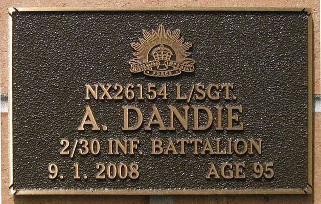 NX26154 - DANDIE, Alexander (Alex), L/Sgt. - HQ Coy. Ord. Room
View of the bronze plaque erected in the NSW Garden of Remembrance on Wall ?, Row ?. The garden is adjacent to Sydney War Cemetery at the Rookwood Necropolis, and is maintained by The Office of Australian War Graves.

The plaques are provided by The Office of Australian War Graves to commemorate eligible veterans who have died post war and whose deaths are accepted as being caused by war service. This form of commemoration is used when there is a private memorial elesewhere, or for some reason, the Office is unable to provide an official memorial at the relevant Cemetery or Crematorium.
Keywords: 100125a