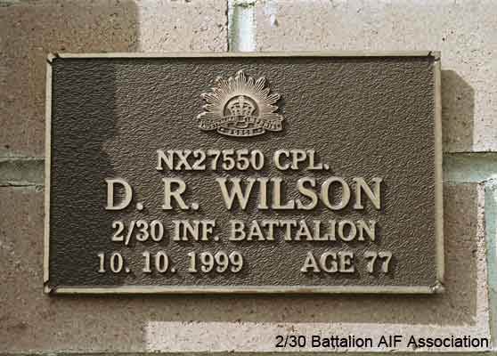 NX27550 - WILSON, David Royce (Doc), A/Cpl. - A Company, 9 Platoon
View of the bronze plaque erected in the NSW Garden of Remembrance on Wall 37, Row J. The garden is adjacent to Sydney War Cemetery at the Rookwood Necropolis, and is maintained by The Office of Australian War Graves.

The plaques are provided by The Office of Australian War Graves to commemorate eligible veterans who have died post war and whose deaths are accepted as being caused by war service. This form of commemoration is used when there is a private memorial elesewhere, or for some reason, the Office is unable to provide an official memorial at the relevant Cemetery or Crematorium.
