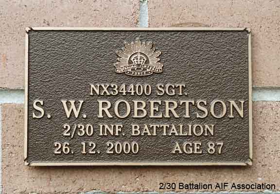 NX34400 - ROBERTSON, Stuart Wilkinson, Sgt. - A Company, 8 Platoon
View of the bronze plaque erected in the NSW Garden of Remembrance on Wall 57, Row G. The garden is adjacent to Sydney War Cemetery at the Rookwood Necropolis, and is maintained by The Office of Australian War Graves.

The plaques are provided by The Office of Australian War Graves to commemorate eligible veterans who have died post war and whose deaths are accepted as being caused by war service. This form of commemoration is used when there is a private memorial elesewhere, or for some reason, the Office is unable to provide an official memorial at the relevant Cemetery or Crematorium.
