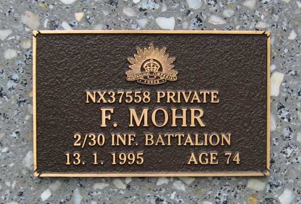 NX37558 - MOHR, Frank Arthur, Pte. - C Company, 15 Platoon
View of the bronze plaque erected in the ACT Garden of Remembrance on Wall 10, Row A, Column 14. The garden is within Woden Cemetery in Canberra, and is maintained by The Office of Australian War Graves.

The plaques are provided by The Office of Australian War Graves to commemorate eligible veterans who have died post war and whose deaths are accepted as being caused by war service. This form of commemoration is used when there is a private memorial elsewhere, or for some reason, the Office is unable to provide an official memorial at the relevant Cemetery or Crematorium.
Keywords: 071031a