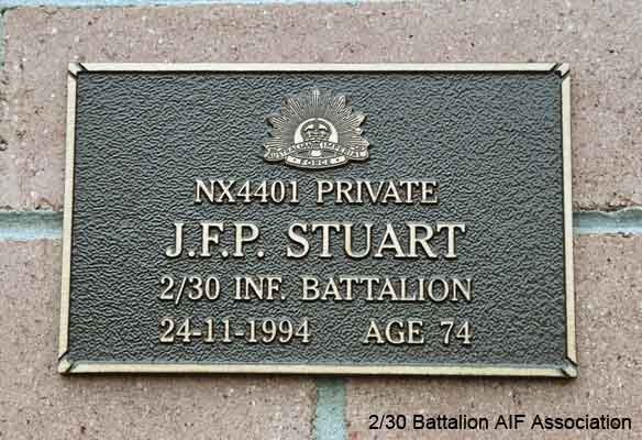 NX4401 - STUART, John Patrick (Jack), L/Cpl. - HQ Company, Transport Platoon
View of the bronze plaque erected in the NSW Garden of Remembrance on Wall 24, Row G. The garden is adjacent to Sydney War Cemetery at the Rookwood Necropolis, and is maintained by The Office of Australian War Graves.

The plaques are provided by The Office of Australian War Graves to commemorate eligible veterans who have died post war and whose deaths are accepted as being caused by war service. This form of commemoration is used when there is a private memorial elesewhere, or for some reason, the Office is unable to provide an official memorial at the relevant Cemetery or Crematorium.
