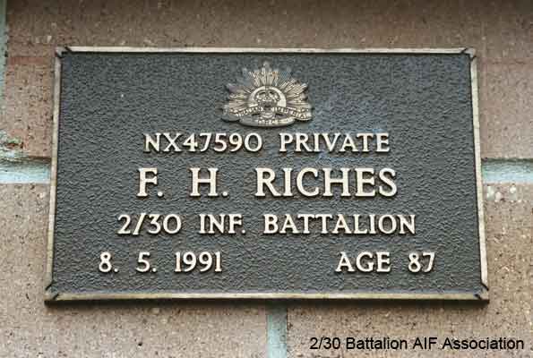 NX47590 - RICHES, Frederick Holmes (Harry), A/U/Cpl. - HQ Company, Transport Platoon
View of the bronze plaque erected in the NSW Garden of Remembrance on Wall ?24 Row D. The garden is adjacent to Sydney War Cemetery at the Rookwood Necropolis, and is maintained by The Office of Australian War Graves.

The plaques are provided by The Office of Australian War Graves to commemorate eligible veterans who have died post war and whose deaths are accepted as being caused by war service. This form of commemoration is used when there is a private memorial elesewhere, or for some reason, the Office is unable to provide an official memorial at the relevant Cemetery or Crematorium.
