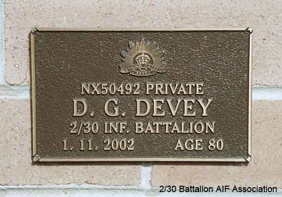 NX50492 - DEVEY, Donald Geoffrey (Don), Pte. - HQ  Company, Transport Platoon
View of the bronze plaque erected in the NSW Garden of Remembrance on Wall 27, Row O. The garden is adjacent to Sydney War Cemetery at the Rookwood Necropolis, and is maintained by The Office of Australian War Graves.

The plaques are provided by The Office of Australian War Graves to commemorate eligible veterans who have died post war and whose deaths are accepted as being caused by war service. This form of commemoration is used when there is a private memorial elesewhere, or for some reason, the Office is unable to provide an official memorial at the relevant Cemetery or Crematorium.
