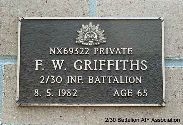 NX69322 - GRIFFITHS, Frederick Wallace (Professor or Fred), Pte. - B Company, 10 Platoon
View of the bronze plaque erected in the NSW Garden of Remembrance on Wall 39, Row C. The garden is adjacent to Sydney War Cemetery at the Rookwood Necropolis, and is maintained by The Office of Australian War Graves.

The plaques are provided by The Office of Australian War Graves to commemorate eligible veterans who have died post war and whose deaths are accepted as being caused by war service. This form of commemoration is used when there is a private memorial elesewhere, or for some reason, the Office is unable to provide an official memorial at the relevant Cemetery or Crematorium.
