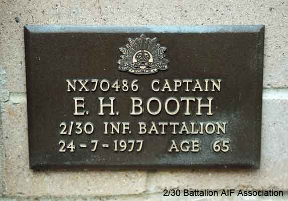 NX70486 - BOOTH, Edward Holroyd (Baldy or Ward), Capt. - D Company, O/C
View of the bronze plaque erected in the NSW Garden of Remembrance on Wall 1, Row D. The garden is adjacent to Sydney War Cemetery at the Rookwood Necropolis, and is maintained by The Office of Australian War Graves.

The plaques are provided by The Office of Australian War Graves to commemorate eligible veterans who have died post war and whose deaths are accepted as being caused by war service. This form of commemoration is used when there is a private memorial elesewhere, or for some reason, the Office is unable to provide an official memorial at the relevant Cemetery or Crematorium.
