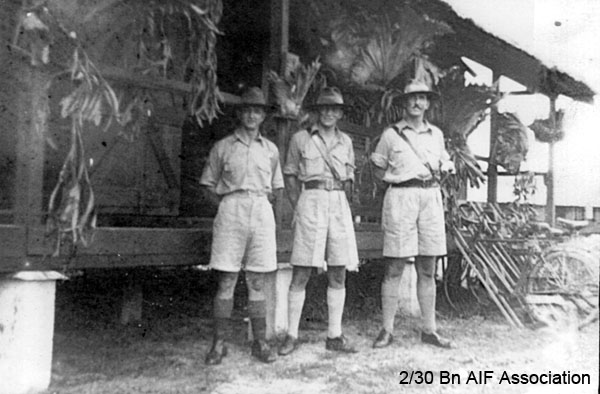 Training in Malaya, 1941
Left to right:
1) NX47951 - NAGLE, Athol Gervase, L/Sgt. - B Ord. Room
2) NX12535 - HOWELLS, Edwin Robert, Capt. - HQ O/C Mortar
3) NX34792 - DUFFY, Desmond Jack, Col. - O/C B Company
Keywords: Malaya