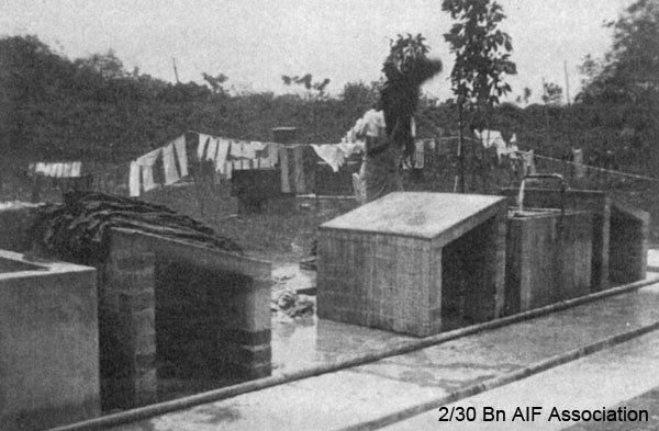 Washing area, Malaya, 1941
"This is the way the dohbys do our washing. Just belt them on a slab of cement"
NX72575 - CONN, Edward John (Jack), Pte. - HQ Company, Signals Platoon
Keywords: NX72575