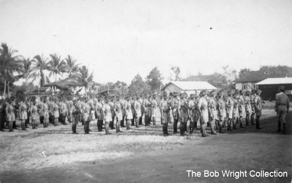 On Parade at Batu Pahat
"H.Q. on Parade. No. 1 Platoon at the front. I'm No. 1 front rank. November 25, 1941."

1) NX36166 - WRIGHT, Robert, Cpl. - HQ Coy. Sig. Pl.

1. The photographs are to be known as The Bob Wright Collection.
2. Reproduction of the Collection or any part of it is prohibited without written permission.
3. Permission is granted to the 2/30th Batallion Association to reproduce the Collection as it deems appropriate.
4. Permission is granted to the Australian War Memorial Museum to reproduce the Collection as it deems appropriate.
5. All other permission is specifically withheld.
6. Written application for permission to reproduce the Collection, or part of it, may be made to:
Mr I. Wright
95 Hewitt Avenue
Wahroonga 2076 New South Wales

