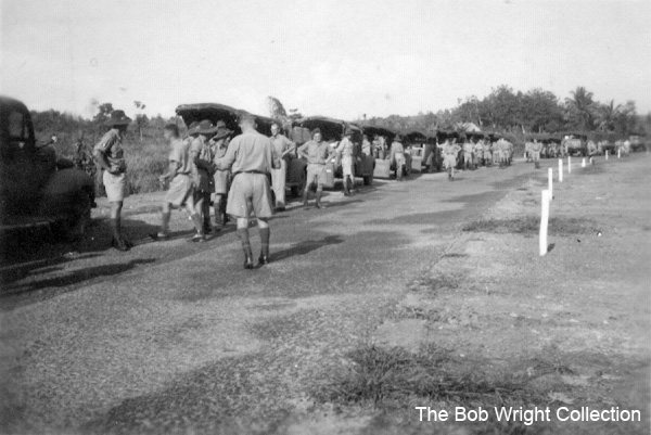 Training in Malaya
"A few of the trucks that took part in our move."

1. The photographs are to be known as The Bob Wright Collection.
2. Reproduction of the Collection or any part of it is prohibited without written permission.
3. Permission is granted to the 2/30th Batallion Association to reproduce the Collection as it deems appropriate.
4. Permission is granted to the Australian War Memorial Museum to reproduce the Collection as it deems appropriate.
5. All other permission is specifically withheld.
6. Written application for permission to reproduce the Collection, or part of it, may be made to:
Mr I. Wright
95 Hewitt Avenue
Wahroonga 2076 New South Wales

