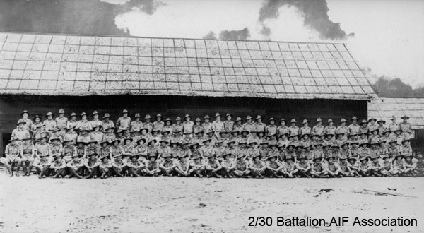C Company
C Company at Batu Pahat, 1941.

Left to right:

Back row:
1) NX37615 - ANDERSON , Kelvin John Eric (Kel), Pte. - C Coy. 13 Pl. 
2) NX53042 - SIMPSON, John Thomas (Jack), Pte. - B Coy. 12 Pl. WiA Fort Rose, Doi Sonkurai 3 (Dysentery, Toxaemia following Amputation)
3) NX36545 - WILLIAMSON, Clarence, Pte. - C Coy. Doi Sonkurai 3 (Dysentery, Malaria)
4) NX37297 - DAVISON, William Arthur, Pte. - C Coy. to 2/20 Bn 18/10/1941 to join his brother
5) NX36528 - WOOD, Clarence William, Pte. - C Coy. 13 Pl. 
6) NX46619 - KORSCH, John Donald, Cpl. - C Coy. 14 Pl. 
7) NX26495 - McMAHON, Bernard Stanislaus (Stonja), Sgt. - C Coy. 14 Pl. 
8) NX41134 - EATHER, Walter Barnett, Sgt. - C Coy. 15 Pl. 13 Pl - A/A Pl
9) NX37593 - COMMANS, John Poole (Jack), Pte. - C Coy. 15 Pl. WiA Gemas
10) NX29461 - SPRING, Alan Thomas, Pte. - C Coy. KiA St. Andrew's Cathedral, Singapore
11) NX47456 - ROWE, Aubrey Nelson (Jack), A/Cpl. - C Coy. 15A Pl. WiA Fort Rose, Doi Sonkurai 1 (Dysentery, Pneumonia)
12) NX54449 - JONES, George Francis McKenzie (Frank), A/L/Cpl. - C Coy. 15 Pl. 
13) NX47466 - REILLY, Arthur William, Pte. - C Coy. 15 Pl. Doi Kanburi (Dysentery)
14) NX33725 - SANDS, Richard Arthur, Pte. - C Coy. 15 Pl. KiA Gemas
15) NX37680 - HOLMAN, Trevor Ian, Pte. - C Coy. 15 Pl. Doi Sonkurai 3 (Dysentery)
16) NX36483 - WEISS, Harry Blanch, Pte. - C Coy. 13 Pl. WiA Gemas, Doi Sonkurai 3 (Beri Beri)
17) NX36501 - PRATT, James, Pte. - C Coy. Coy. HQ Pl. WiA Gemas, Doi Sonkurai 3 (Dysentery) 
18) NX66981 - DENGATE, Edgar Norman, Lt. - B Coy. O/C 12 Pl. Lt. from 10/11/1941
19) NX37632 - SMEDLEY, Walter Rex, Pte. - C; HQ Coy. 15; Carrier Pl. Driver/Mechanic, Carrier 13; Doi Khorkan
20) NX37476 - GANTLEY, Alfred James, Pte. - BHQ Coy.
21) NX47218 - GRAINGER, Stanley Harold, Pte. - C Coy. 15A Pl. 
22) NX37366 - TOWERS, Keith Lloyd, L/Cpl. - C Coy. 14 Pl. 
23) NX47760 - MARSH, Stanley Frederick, Pte. - C Coy. 14 Pl. Doi Sonkurai 1 (Cholera)
24) NX36535 - RANDLE, Edward R. (Ted/ Snowy), Pte. - A Coy.
25) NX37317 - LANE, Hector Doyle, Pte. - C Coy. WiA Sempang Rengam
26) NX37604 - HILTON, Emanuel Patrick (Mick), Pte. - D Coy. 16 Pl. WiA Gemas
27) NX37733 - JOYCE, Ronald Joseph, Pte. - HQ Coy. Mortar Pl. KiA Ayer Hitam
28) NX15563 - VINCENT, Horace Robert William (Ossie), Pte. - C Coy. 15A Pl. Doi Nieke (Beri Beri, Dysentery, Anaemia)
29) NX59092 - STARK, Reginald, L/Cpl. - C Coy. 14 Pl. to Rose Force 23/12/1941, KiA Sempang Rengam (D Coy area)
30) NX36556 - HOSKINSON, James Charles (Big Jim), Cpl. - C Coy. 13 Pl. Doi Sonkurai 3 (Beri Beri)
31) NX47445 - CRAIG, Archibald John, Pte. - C Coy. 13 Pl. 
32) NX37281 - HAMLIN, Victor Percy (Vic), Pte. - C Coy. 13 Pl. 
33) NX37296 - JONES, Ashley Chave, Pte. - C Coy. 13 Pl. 
34) NX37498 - JACK, Robert William, Sgt. - C Coy. 13 Pl. 
35) NX37304 - CONDIE, Edward Patrick (Ted), Pte. - C Coy. 

Third row:
1) NX53537 - CLYNE, Edward Francis (Ted), S/Sgt. - C Coy. CQMS Pl. Doi Sandakan
2) NX47748 - JOHNSON, George Edward Thomas (Big Johnno), A/U/Sgt. - C Coy. 15A Pl. 
3) NX32334 - SURTEES, Robert Edward James (Bob), L/Sgt. - C Coy. Ord. Room Pl. 
4) NX37951 - MARTIN, Edward Budd, Pte. - C Coy. to MLFDU 17/3/1942
5) NX37607 - CRAM, Jack Gordon, Pte. - BHQ Coy. to AASC 4/10/1941
6) NX4337 - TAYLOR, Blair, Pte. - C Coy. 15 Pl. Rose Force 23/12/41
7) NX36301 - GRIFFITHS, Albert (Nookie), Pte. - C Coy. 15 Pl. 
8) NX36377 - RANDLE, Francis George Edward (Frank), Pte. - C Coy. 15 Pl.
9) NX46643 - REARDON, Francis William (Frank), Pte. - C Company, 15 Platoon (not NX29716 - BLACKER, Cecil Richard, Pte. - C Company)
10) NX26943 - TOPHAM, Frank, Pte. - C Coy. 15 Pl. AAOC Boot repair, Changi
11) NX47544 - SWEENEY, Ronald Lennox (Rogo), L/Cpl. - C Coy. 15 Pl. 
12) NX47009 - QUIRK, William George, Pte. - C Coy. 15 Pl. Doi Tanbaya (Beri Beri, Dysentery)
13) NX36487 - STEVENS (Stephens), Thomas, Pte. - C Coy. 15 Pl. 
14) NX7248 - MAY, Frederick George (Fred), Pte. - C Coy. 15 Pl. Ex "A" Force; sent from Thailand to Japan after Railway completed; Rakuyo Maru torpedoed and sunk 12/9/1944 by US submarine
15) NX53747 - SHAW, Mervyn David, Pte. - C Coy. Coy. HQ Pl. Doi Sonkurai 1 (Cholera)
16) NX36479 - HOLLOWAY, Maxwell George, Pte. - C Coy. 14 Pl. MiA 12/2/1942
17) NX37335 - JENKINS, Edward Rossborough Melbourne (Bernie), L/Cpl. - C Coy. 13 Pl. Doi Tanbaya (Beri Beri)
18) NX915 - EDWARDS, Frederick Henry, Pte. - Repatriated 15/01/1942
or 18)	NX46920 - HEDWARDS, Cornelius Michael (Con), Pte. - C Company, 14 Platoon
19) NX51236 - LAWSON, Robert George, Pte. - C Coy. 14 Pl. 
20) NX55473 - O'DONNELL, Colin Squire (Col), Sgt. - C Coy. 15 Pl. 
21) NX47752 - NEWMAN, Robert John (Bob), Pte. - C Coy. 14 Pl. 
22) NX37538 - LITTLEJOHN, George Ernest, Pte. -  to 27 Bde 7/10/1941
23) NX47154 - MACOURT, Laurie Leo, Pte. - C Coy. 14 Pl. Doi Kanburi (Lobar Pneumonia)
24) NX47498 - GRANT, Thomas Bertram (Tom ), L/Cpl. - C Coy. 14 Pl. 
25) NX37705 - O'ROURKE, Terence Percival (Terry), Pte. - C Coy. 14 Pl. 
26) NX37702 - BICKNELL, Thomas John, L/Cpl. - C Coy. 15A Pl. 
27) NX46605 - McEWEN, Charles, Pte. - C Coy. 14 Pl. WiA Sempang Rengam
28) NX46640 - PHILP, Sydney Phillip, Pte. - C Coy. 14 Pl. Doi Sonkurai 1 (Cholera)
29) NX46603 - McKENZIE, Donald (Don), L/Cpl. - C Coy. 14 Pl. 
30) NX46983 - McLAREN, Hilton Stanley, Pte. - C Coy. 15A Pl. WiA Sempang Rengam
31) NX55568 - CONEN, Sidney Graham (Sid), Pte. - C Company, 14 Platoon 
32) NX50287 - LE CLERCQ, Alan Edward, Pte. - C Coy. 13 Pl. Doi Sandakan
33) ? - OSBORN, E.G.
34) NX27012 - SCHOFIELD, Phillip Alfred (Schoey), WO2 - C Coy. CSM Pl. MiD; took over driving of C Coy truck after Tom PEARCE killed at Gemas

Second row:
1) NX37374 - THORBURN, Archibald John Kennedy (Arch), A/U/L/Sgt. - C Coy. Coy. HQ Pl. 
2) NX37666 - MAY, Eric Francis (Bunny), Pte. - C Coy. Coy. HQ Pl. 
3) NX57422 - RILEY, Neville Thomas, Pte. - HQ Coy. Carrier Pl. Gunner, Carrier 13
4) NX47871 - WALLIS, Edmund Winston (Punter), Pte. - C Coy. 15 Pl. 
5) NX36510 - COX, Allan Ray, Pte. - C Coy. 15 Pl. WiA Gemas, Doi Sonkurai 1 (Cholera)
6) NX37558 - MOHR, Frank Arthur, Pte. - C Coy. 15 Pl. MiA 28/1/1942
7) NX54468 - ENNIS, William, A/Sgt. - C Coy. 15 Pl. WiA Sungei Seletar
8) NX50333 - NUGENT, Mervyn Cecil, A/U/Cpl. - C Coy. 15 Pl. 
9) NX47004 - ROCKETT, Thomas, Cpl. - C Coy. 15 Pl. 
10) NX37616 - DICKINSON, Archibald James, Pte. - C Coy. 15 Pl. 
11) NX29283 - JENNINGS, Edward Henry, Sgt. - C Coy. 15 Pl. KiA Sempang Rengam
12) NX16090 - DENTON, Cyril Roy, Pte. - C Coy. 15 Pl. Doi Sonkurai 3 (Dysentery)
13) NX37614 - WITHERS, Dudley James, Pte. - to 8 Div. Sigs. 10/11/1941, MpD
14) NX37583 - KIELY, Thomas Joseph, Pte. - C Coy. to 27 Bde 7/10/1941, Doi Tamaranpah (Cholera)
15) NX33393 - PEGRUM, Reginald Oliver, Pte. - A Coy. to 2/20 Bn 18/10/1941
16) NX37542 - SAVAGE, Alfred Gordon (Gordon), Pte. - C Coy. 15A Pl. 
17) NX32588 - CLEMENS, Percival Webster (Mick), Lt. - C Coy. O/C 13 Pl. KiA Gemas
18) NX70458 - MASTON, Ronald Harry (Bomb Happy), Capt. - C Coy. 2 l/c C Coy. 
19) NX34738 - LAMACRAFT, Alfred Howard Maudslay, Capt. - C Coy. O/C C Coy. E.D.
20) NX34950 - PARSONS, Ernest John (John), Lt. - C Coy. O/C 14 Pl. 
21) NX70690 - CLAYTON, Hedley Stanley (Basher Bill), Lt. - C Coy. O/C 15 Pl. WiA Fort Rose
22) NX36536 - RANDLE, Ernest Harold, Pte. - A Coy. 7 Pl. WiA Tyersall Palace 
23) NX46620 - KRUSE, Bruce Edward, Pte. - C Coy. 14 Pl. 
24) NX69350 - MITCHELL, Jack (John Earl) (Jack), Pte. - C Coy. 14 Pl. 
24) NX72254 - BRENNAN, Reginald Ivan (Reg), Pte. - BHQ Coy. D&P Pl.
25) NX37312 - WILSON, John Whiteman, Pte. - C Coy. 13 Pl. WiA Mandai Rd., MpD
26) NX47787 - DONNELLY, Clifford Gerald, Pte. - C Coy. to 2/20 Bn 18/10/1941
27) NX37282 - COULTAS, Stanley Thomas (Stan), Pte. - C Coy. 14 Pl. 
28) NX37294 - FORWARD, Kenneth (Frank Walter Leslie) (Ken), Pte. - C Coy. 13 Pl. 
29) NX47104 - KITCHENER, Izra James (Jim), Pte. - C Coy. 14 Pl. Doi Kanburi (Beri Beri)
30) NX47801 - HARRINGTON, Ernest Clarence, Pte. - HQ Coy. Carrier Pl. MpD Singapore Island
31) NX4410 - BYRNE, Neal Broughton Grey, Pte. - C Coy. 15A Pl. Doi Sandakan
32) NX37388 - FINN, James Allen, Pte. - C Coy. 14 Pl. Doi Sandakan
33) NX47377 - FLANAGAN, Frederick Robert, Pte. - C Coy. 13 Pl. 
34) NX2538 - JOHNSTON, Ronald Athol, Cpl. - C Coy. 14 Pl. 
35) NX37305 - KENTWELL, Ronald (Popeye), Pte. - C Coy. 13 Pl. 
36) NX37575 - MITCHELL, Bruce, Cpl. - C Coy. 13 Pl. Doi Kanburi (Post Dysentery)

Front row:
1) NX47925 - RANKIN, Charles William (Bill), Pte. - C Coy. 14 Pl. Doi Sandakan
2) NX37308 - GILL, Leslie Bede (Curlie), Pte. - C Coy. 13 Pl. 
3) NX24742 - CHIPPS, Ronald Lawrence, Pte. - C Coy. 15 Pl. WiA Sempang Rengam
4) NX2712 - WEBBER, Harry George, L/Cpl. - C Coy. 15 Pl. 
5) NX36532 - FOWLER, Keith Allen (Chook), Pte. - C Coy. 15 Pl. WiA Gemas
6) NX26185 - BUTT, Frederick George (Fred), A/Sgt. - C Coy. 15 Pl. WiA Sempang Rengam
7) NX59062 - BUTT, Edward William Bartlett (Ted), Cpl. - C Coy. 15 Pl. Doi Sonkurai 3 (Malaria, Dysentery, Heart Failure)
8) NX47008 - SILVER, Frank Michael, Pte. - C Coy. 15 Pl. 
9) NX36493 - HANNA, Rupert Clyde, Cpl. - C Coy. 15 Pl. Doi Kanburi (Cardiac Beri Beri)
10) NX47542 - SMALL, Mervyn Lindsay (Jimmy), Pte. - C Coy. 15 Pl. Drove out one of the C Coy trucks from Gemas
11) NX47702 - CAVANAUGH, Charles, Pte. - C Coy. MpD Gemas
12) NX17253 - LANE, John Charles (Dinny), Pte. - C Coy. 14 Pl. 
13) NX37561 - BLACK, Donald Wrixon (Don), Pte. - C Coy. 13 Pl. WiA Mandai Rd, also B.C.O.F.
14) NX47453 - THOMPSON (Eugarde), Frederick George (Percival) (Percy), Cpl. - C Coy. 13 Pl. 
15) NX37631 - KNOX, Raymond Charles (Andy), Pte. - C Coy. 14 Pl. 
16) NX57774 - JOHNSON, Timothy, Pte. - C Coy. 13 Pl. Doi Sonkurai 3 (Cerebral Malaria)
17) NX59028 - ERRINGTON, Harry Ronald, Pte. - C Coy. 13 Pl. Doi 105K Burma
18) NX55420 - POLLARD, Leonard Ferris, Pte. - C Coy. Coy. HQ Pl. Doi Khorkan (Tropical Ulcers, Dysentery)
19) NX38682 - McDOUGALL, Eldred Ernest (Jock), A/U/Sgt. - C Coy. 15A Pl. 
20) NX37608 - LEE, Arthur, Pte. - HQ Coy. Sig. Pl. to 2/19 Bn 2/2/1943 to join Brother-in-law NX19873 BURNS, Walter John (Wally); D Force S Bn, then Japan
21) NX47351 - DARE, Thomas Lionel, A/Cpl. - C Coy. 13 Pl. 
22) NX36533 - WEBSTER, Sidney Linden, Pte. - D Coy. KiA Mandai Rd.
23) NX47295 - EAREA, Harry James Manning, L/Cpl. - C Coy. 13 Pl. Doi Kanburi (Dysentery, Beri Beri)
24) NX47207 - LACEY, Kenneth James, L/Cpl. - C Coy. 13 Pl. 
25) NX47279 - BREESE, John Frederick, Pte. - C Coy. 13 Pl. Doi Sonkurai 1 (Dysentery, Peritonitis)
26) NX47209 - KENNEDY, Thomas Joseph Frederick (Tom), A/U/Sgt. - C Coy. 14 Pl. 
27) NX37588 - FERGUSON, Ronald John, Pte. - C Coy. 14 Pl. KiA Sempang Rengam
28) NX27652 - LARKING, Cecil James (House Detective), Pte. - HQ Coy. Sig. Pl.

Absent:
1) NX18363 - WHITBREAD, Norman Harold Clement, L/Cpl. - C Coy. 13 Pl. KiA Mandai Rd.
2) NX47566 - PEARCE, Thomas Francis (Tom ), Pte. - HQ Coy. Tpt. Pl. KiA Gemas when driving out C Coy truck, taken over by Phil Schofield
3) NX47011 - PURSE, Frederick William, Pte. - C Coy. 15 Pl. KiA Fort Rose
4) NX55401 - KENT, Charles Sydney, Pte. - C Coy. Ex 2/19 Bn ?/?/?; KiA Causeway
5) NX26865 - POPE, John Sidney Malcolm (Jack), Pte. - C Coy. 15 Pl. 
6) NX27065 - PANKHURST, William Ashley, Pte. - C Coy. 15 Pl. 

Keywords: NX7248MAY